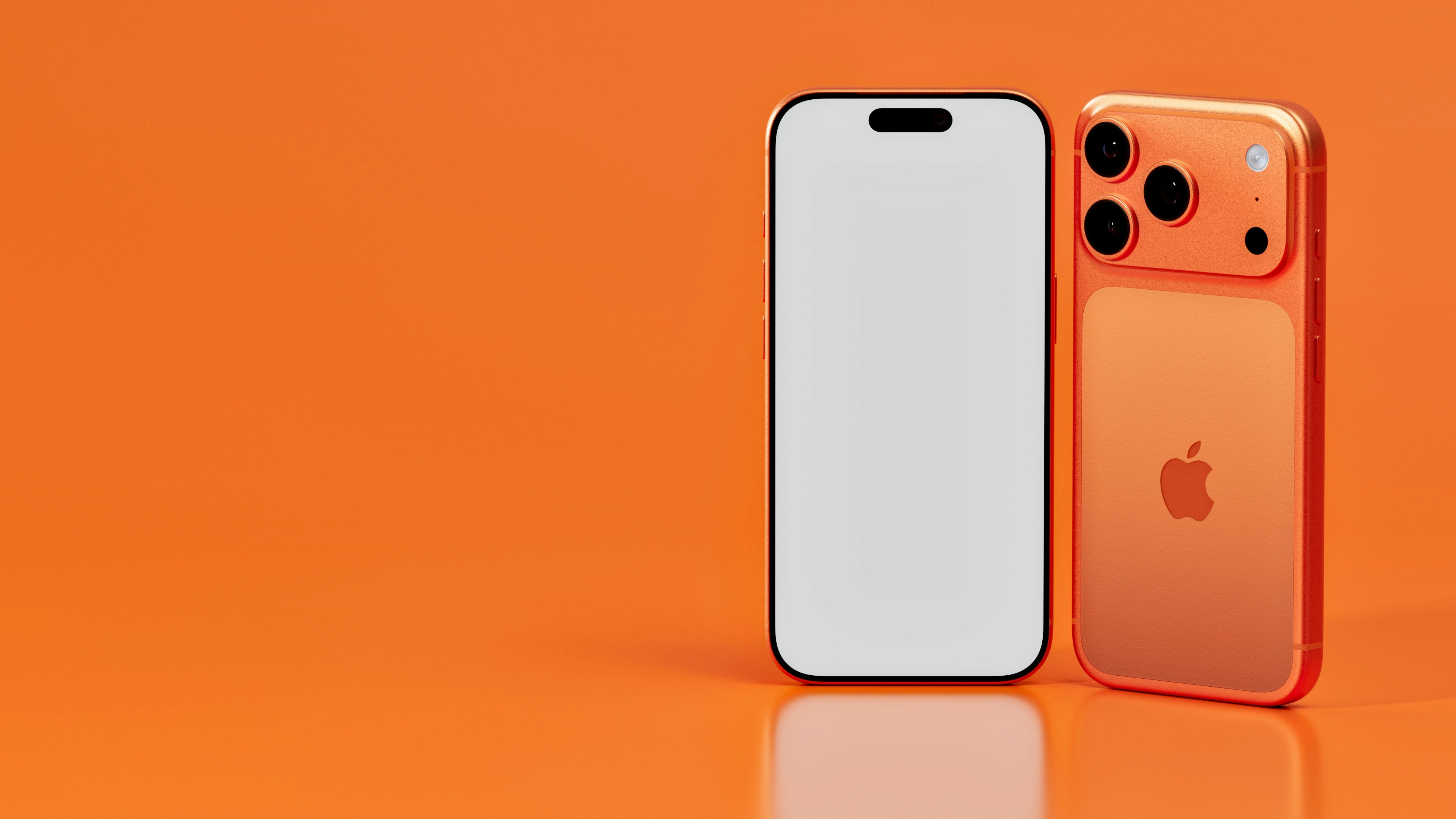Two orange iPhones against a bright orange background